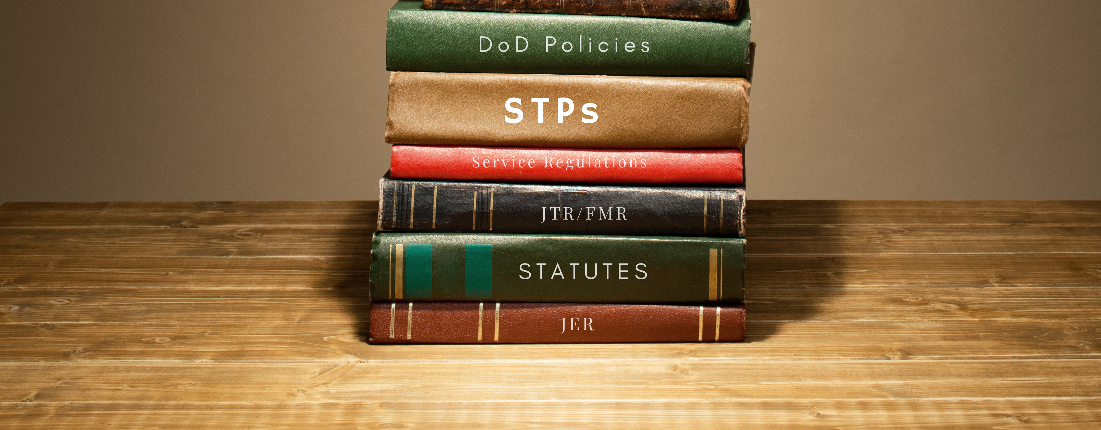 Stack of books, with 'STP's written on one of the spines